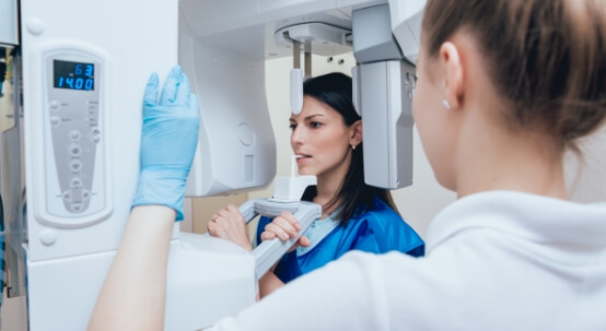 Woman getting dental scans taken using advanced dental technology in Commack