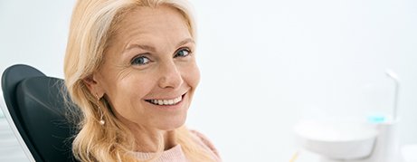 Woman smiling in the dental chair