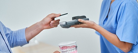 Patient paying for treatment with credit card