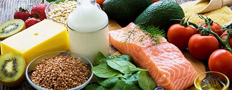A selection of healthy foods against a rustic wooden background