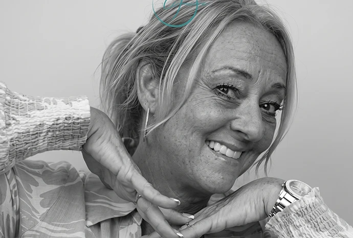 Donna smiling in a black-and-white portrait