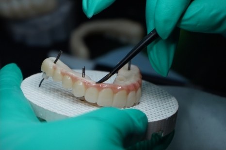 Custom denture being finished in the in-house lab