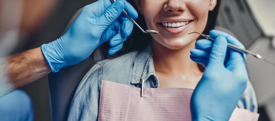 Patient in dental chair, smiling