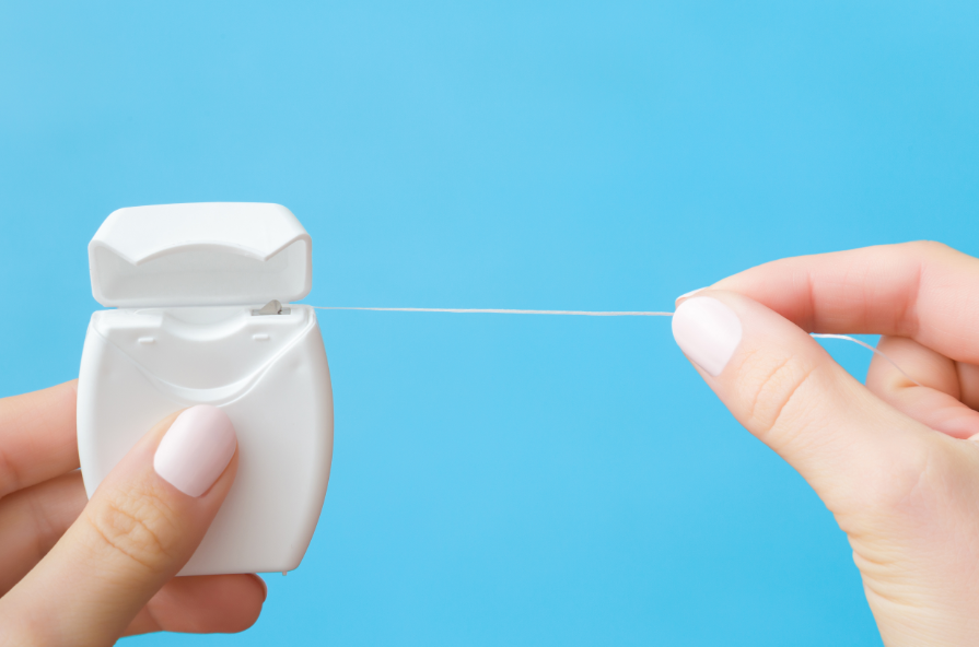Hands holding floss